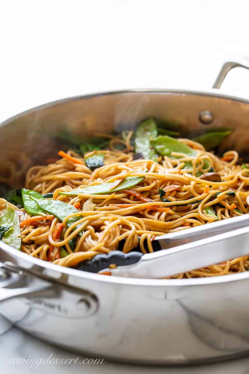 A skillet filled with Lo Mein noodles and vegetables