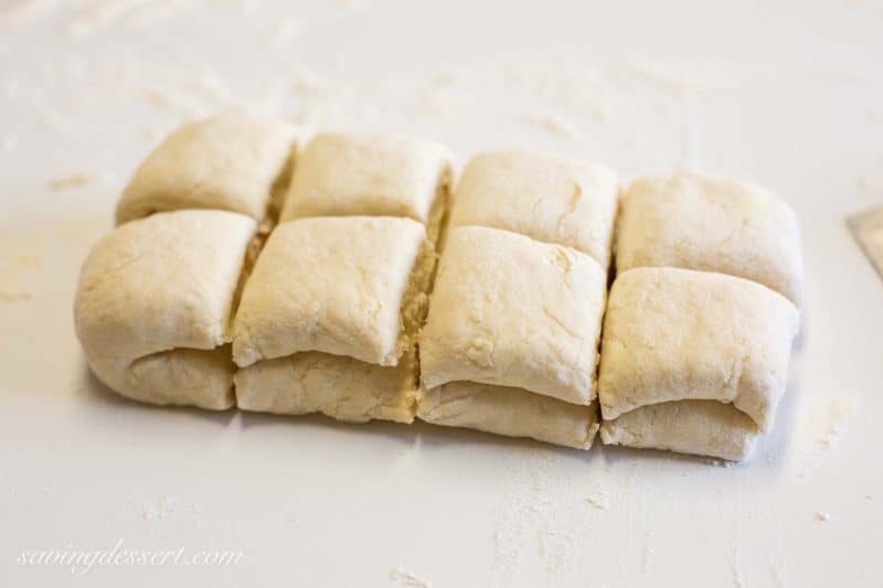 Buttery Apricot Scones ~ A light, flaky, buttery scone layered with chopped apricots and iced with an almond flavored glaze. www.savingdessert.com