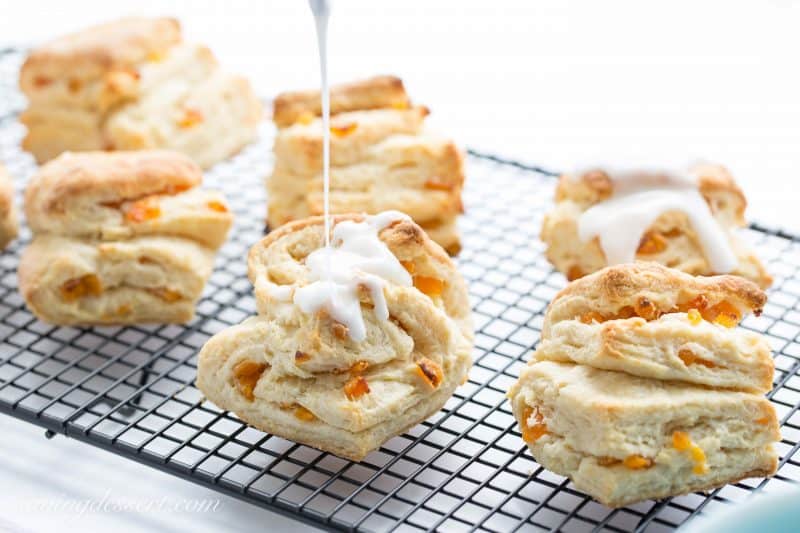 Buttery Apricot Scones ~ A light, flaky, buttery scone layered with chopped apricots and iced with an almond flavored glaze. www.savingdessert.com