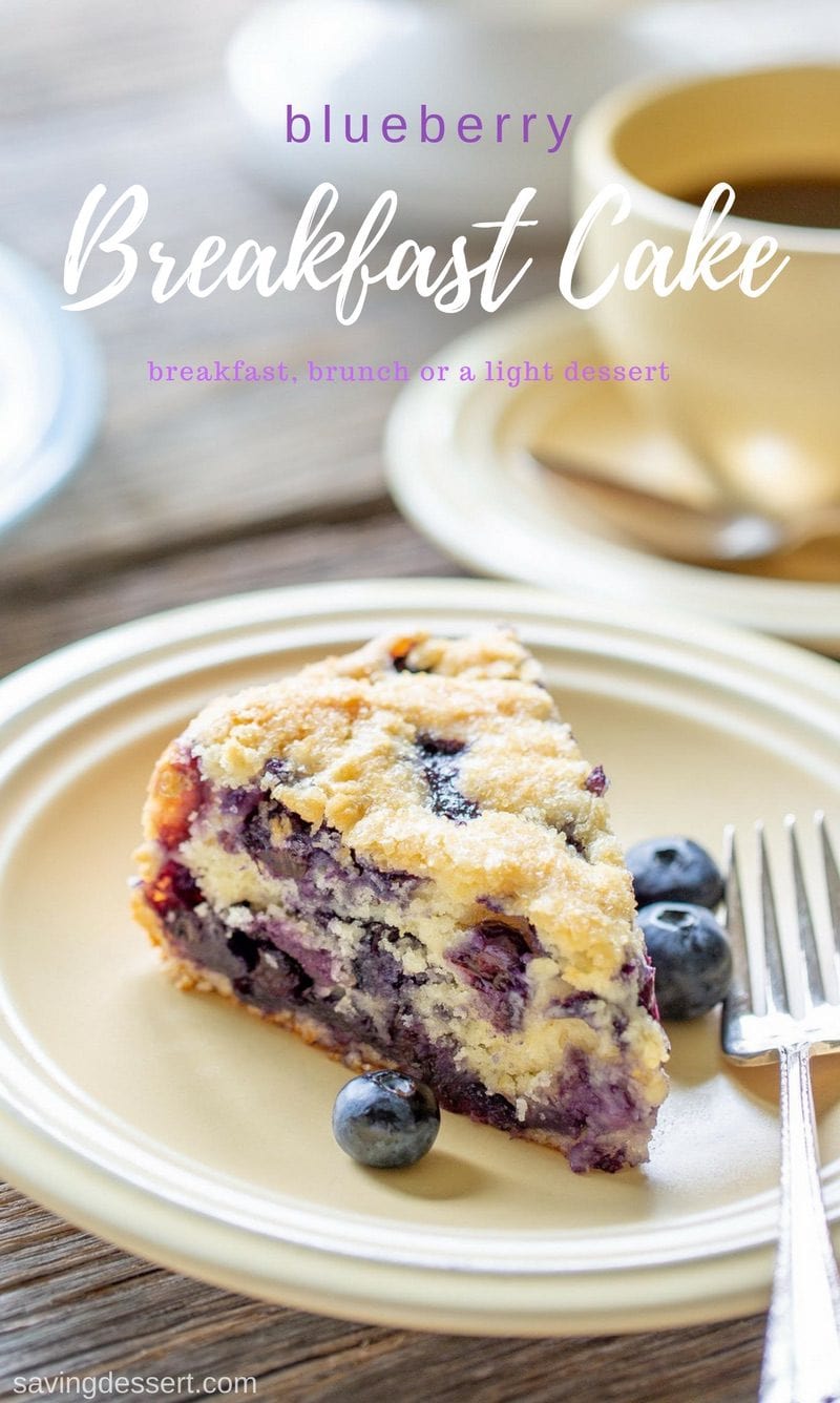 A slice of blueberry breakfast cake with a cup of coffee