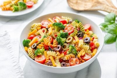 A bowl of summertime pasta salad amongst Rotini spiral noodles Easy Pasta Salad Recipe