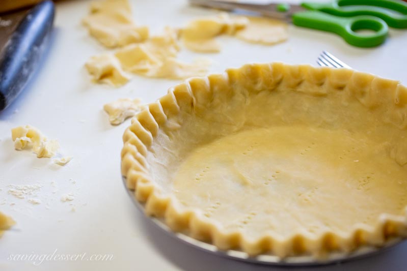 An unbaked pie crust ready for the oven