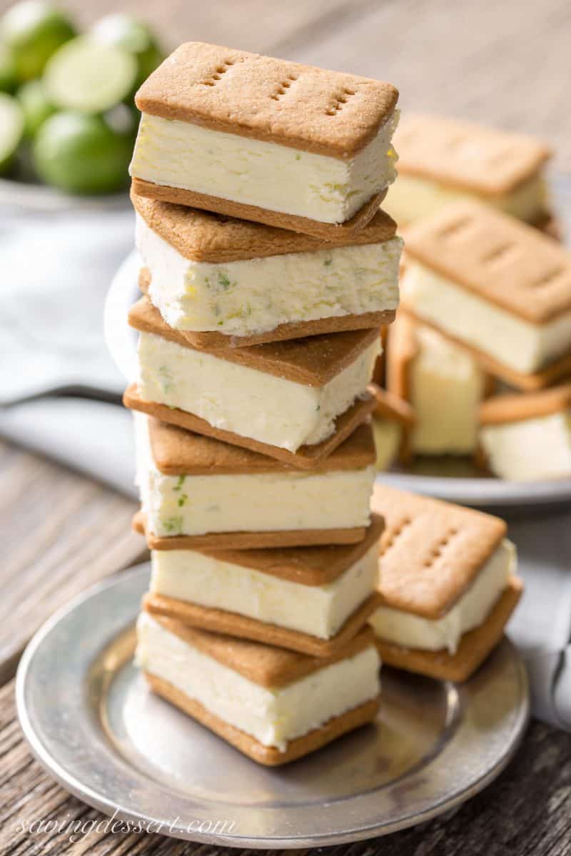 A stack of homemade key lime ice cream sandwiches with homemade graham crackers