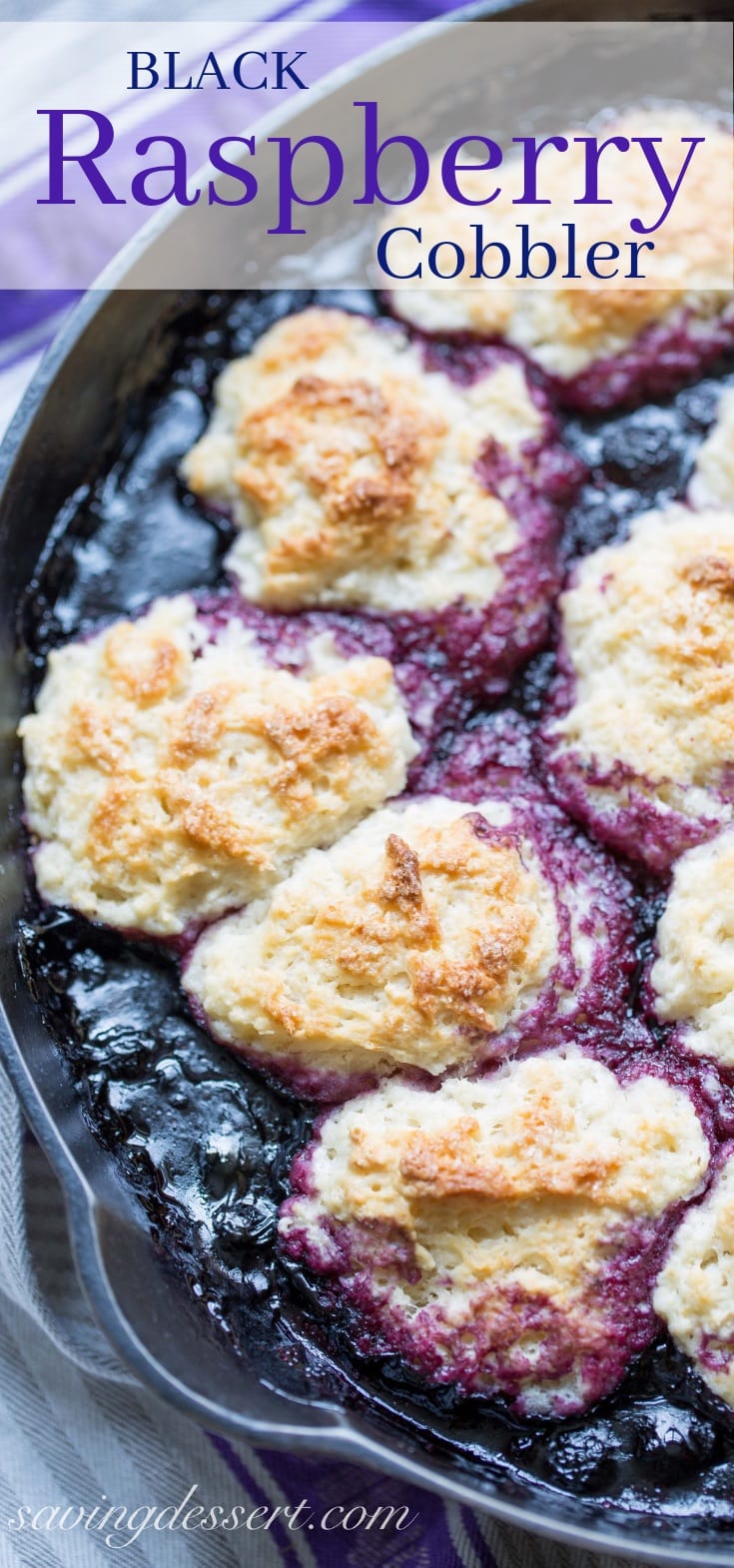 A cast iron skillet with black raspberry cobbler