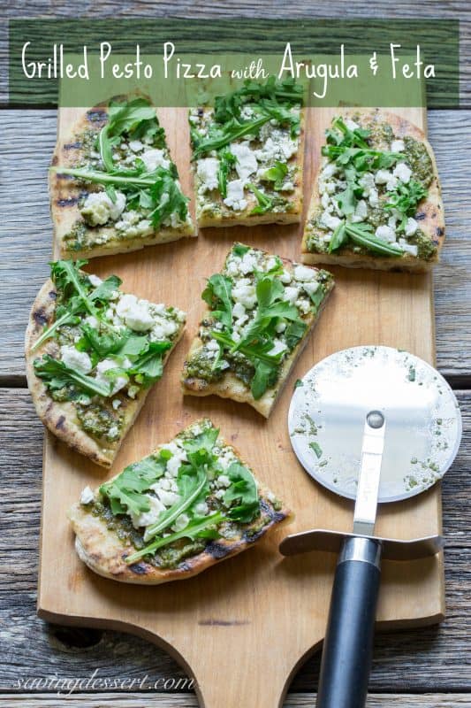 Pesto Grilled Pizza ~A full flavored pizza made with fresh Basil Pesto and peppery arugula. Feta cheese adds a nice creamy bite to this simple but tasty pizza