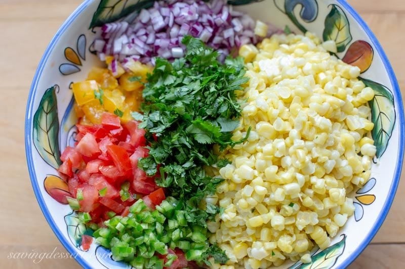 fresh corn, chopped tomatoes, onions and jalapeños with cilantro