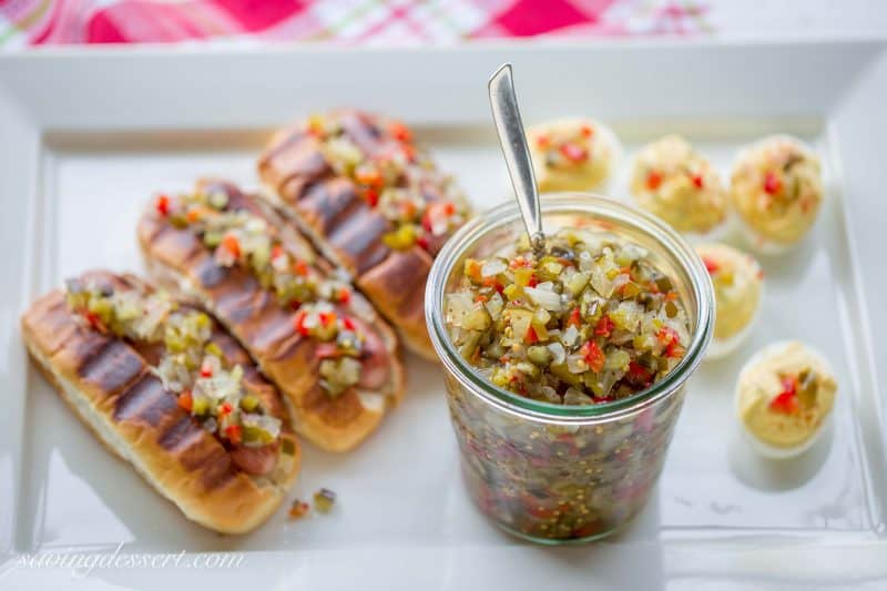 Homemade Sweet Pickle Relish - made with fresh from the garden cucumbers. Delicious served on hot dogs, deviled eggs or in all your summer salads. www.savingdessert.com