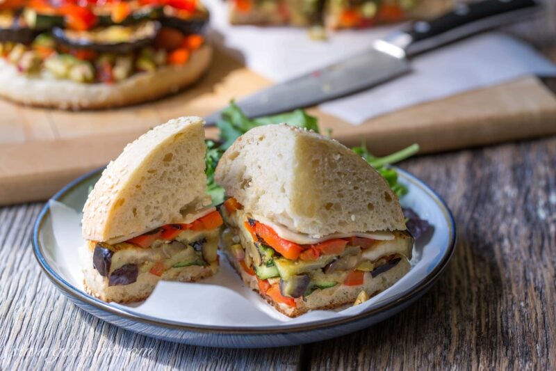 Vege Muffalettas - a vegetarian version of the popular sandwich. Grilled fresh vegetables, provolone cheese and an olive salad piled on a homemade muffuletta loaf | www.savingdessert.com