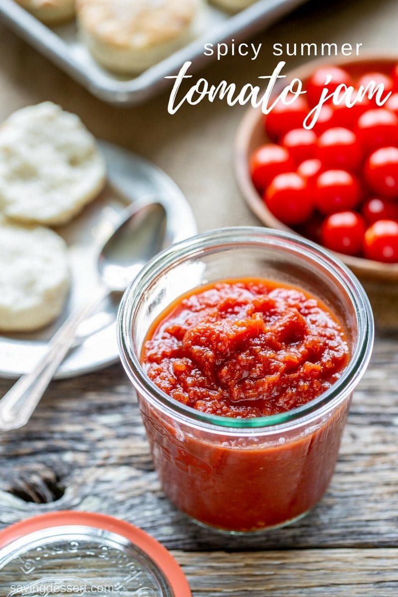 A jar of spicy summer tomato jam with biscuits