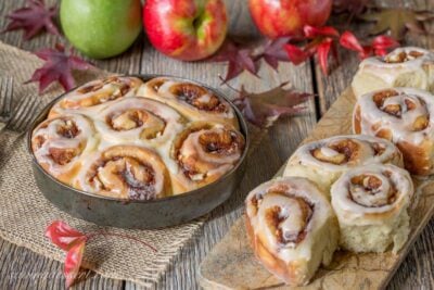 Apple Cinnamon Rolls amongst an Apple Cider Glaze Apple Cinnamon Rolls amongst Apple Cider Glaze