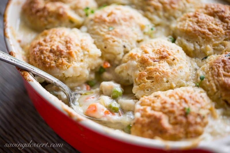 Chicken pot pie casserole topped with herb biscuits