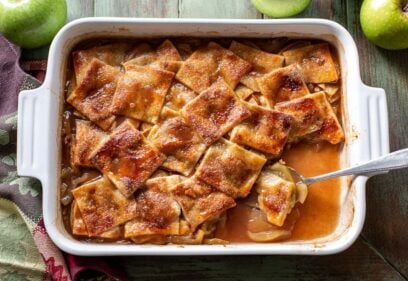 Overhead view of a pan with apples and pastry crust