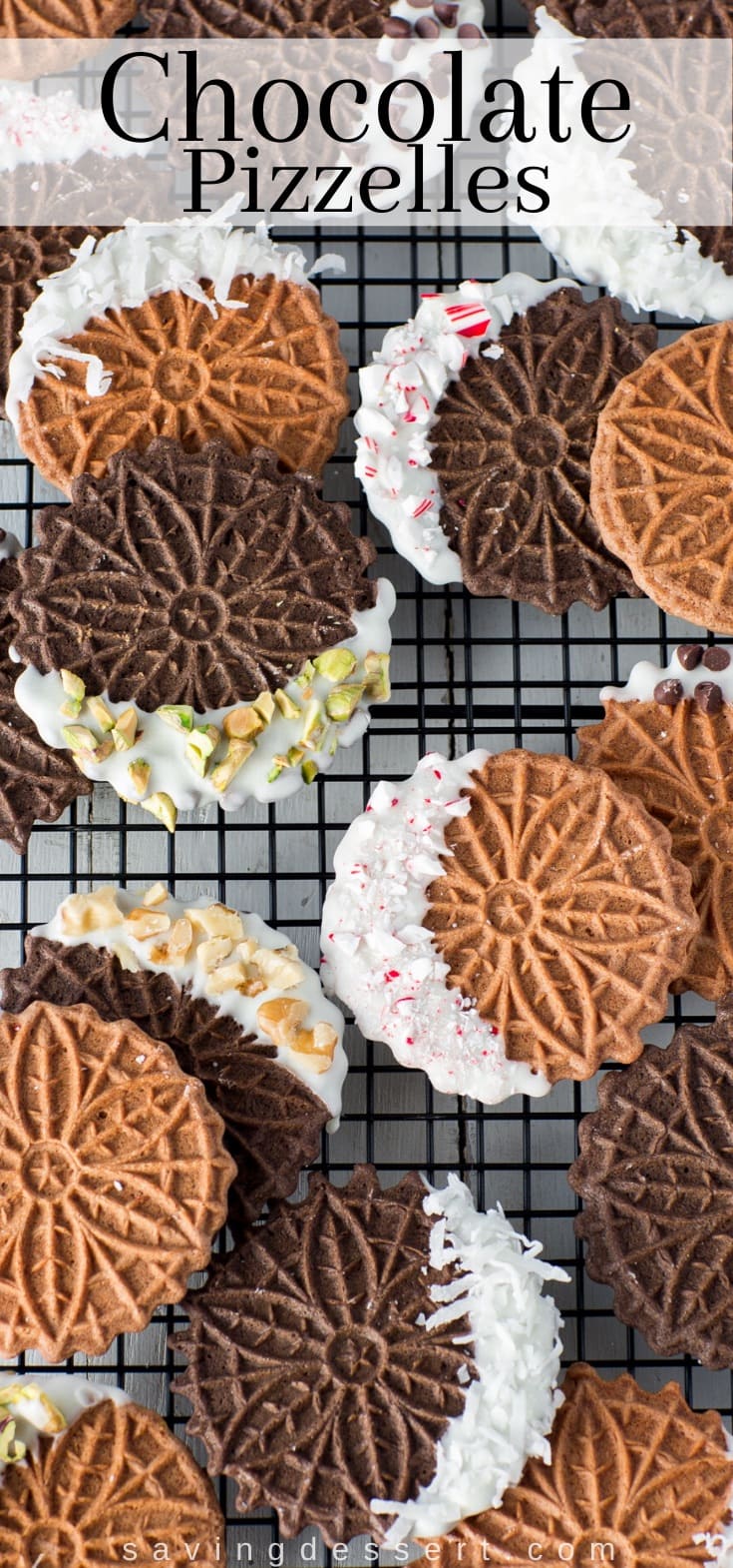 A cooling rack covered in chocolate pizzelle cookies dipped in white chocolate