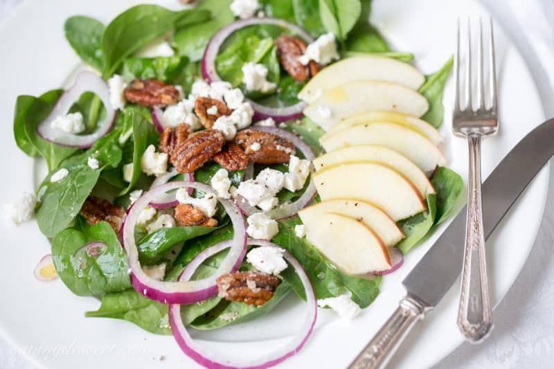 Spinach-Apple Salad with Maple Vinaigrette -Fresh spinach salad with sliced apple, fresh soft goat cheese, red onion slices and sugared pecans and dressed up with a terrific maple-cider vinaigrette with Dijon mustard