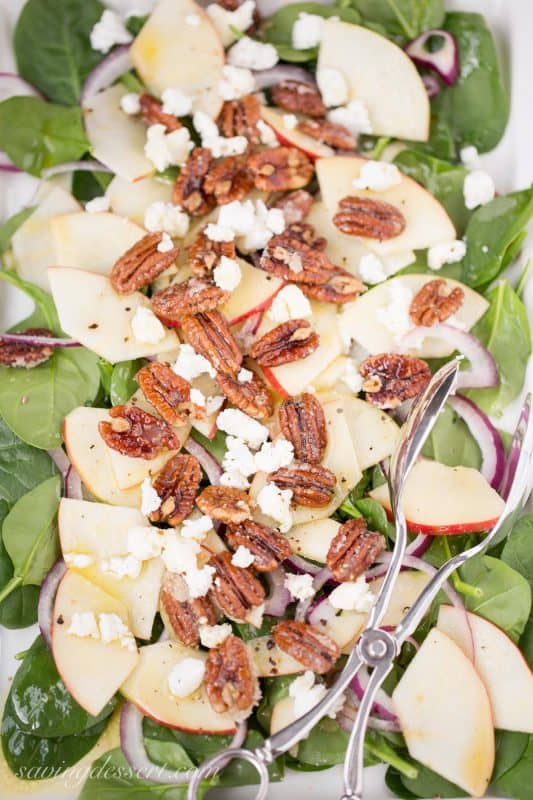 Spinach-Apple Salad with Maple Vinaigrette - Fresh spinach salad with sliced apple, fresh soft goat cheese, red onion slices and sugared pecans and dressed up with a terrific maple-cider vinaigrette with Dijon mustard