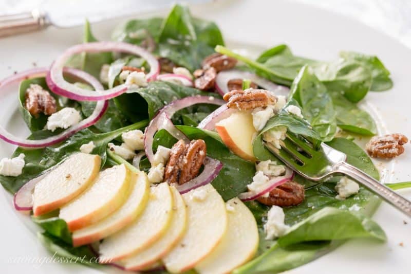 Spinach-Apple Salad with Maple Vinaigrette - Fresh spinach salad with sliced apple, fresh soft goat cheese, red onion slices and sugared pecans and dressed up with a terrific maple-cider vinaigrette with Dijon mustard
