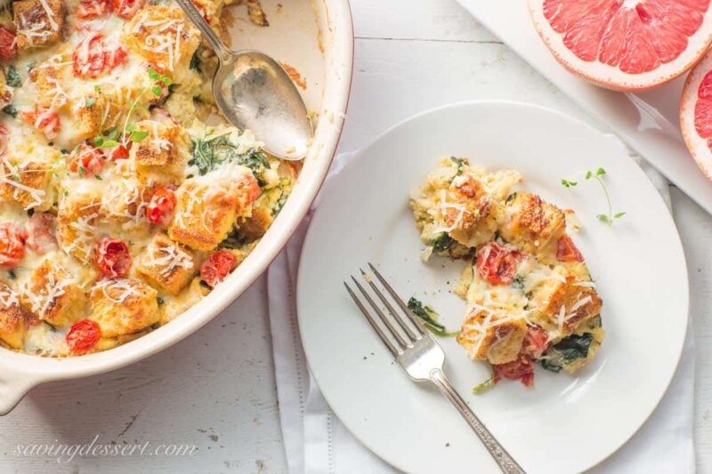 Spinach, Onion & Cheese Breakfast Strata ~ a delicious make-ahead, overnight breakfast or brunch casserole. You won't miss the meat with hearty chunks of Italian bread, ripe cherry tomatoes and rich Gruyere cheese this breakfast casserole is sure to please your hungry crowd!