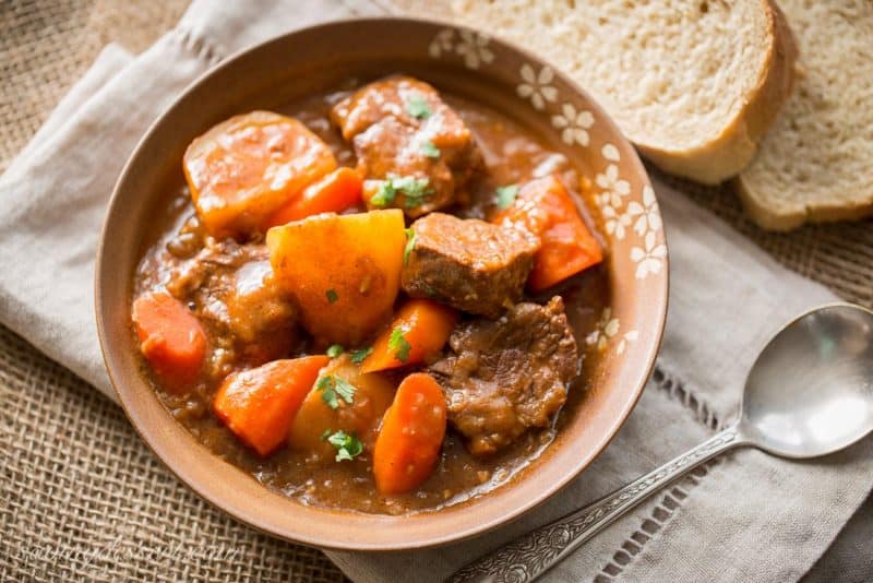 A bowl of tender Guinness Beef Stew served with bread