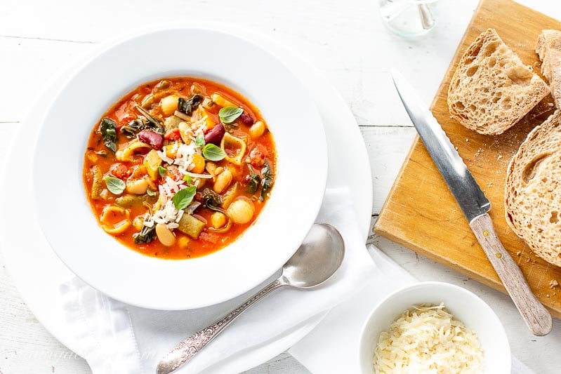 A bowl of like shooting fish in a barrel Minestrone Soup amongst grated Parmesan as well as fresh breadstuff Minestrone Soup