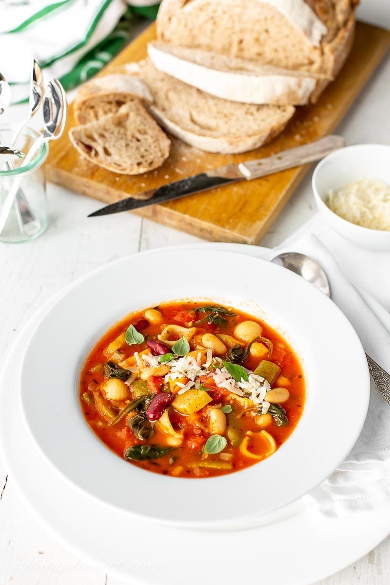 A bowl of like shooting fish in a barrel Minestrone Soup amongst grated Parmesan as well as fresh breadstuff Minestrone Soup