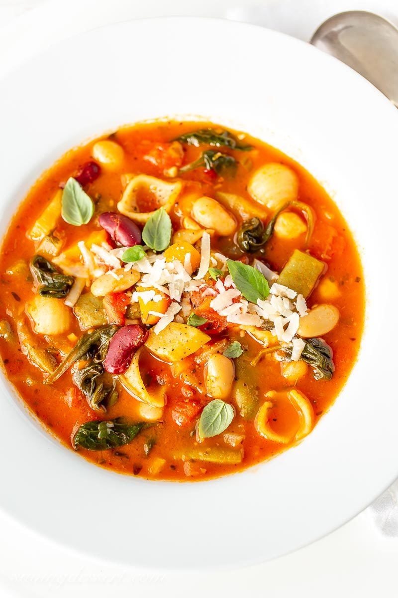 A bowl of like shooting fish in a barrel Minestrone Soup amongst grated Parmesan as well as fresh breadstuff Minestrone Soup