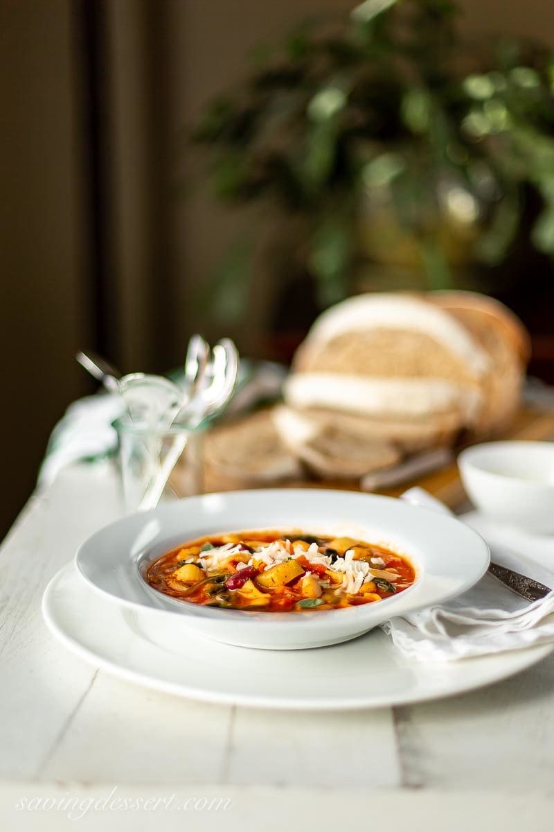 A bowl of like shooting fish in a barrel Minestrone Soup amongst grated Parmesan as well as fresh breadstuff Minestrone Soup