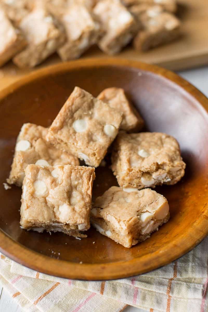 A bowl of coconut rum blondies with white chocolate chips