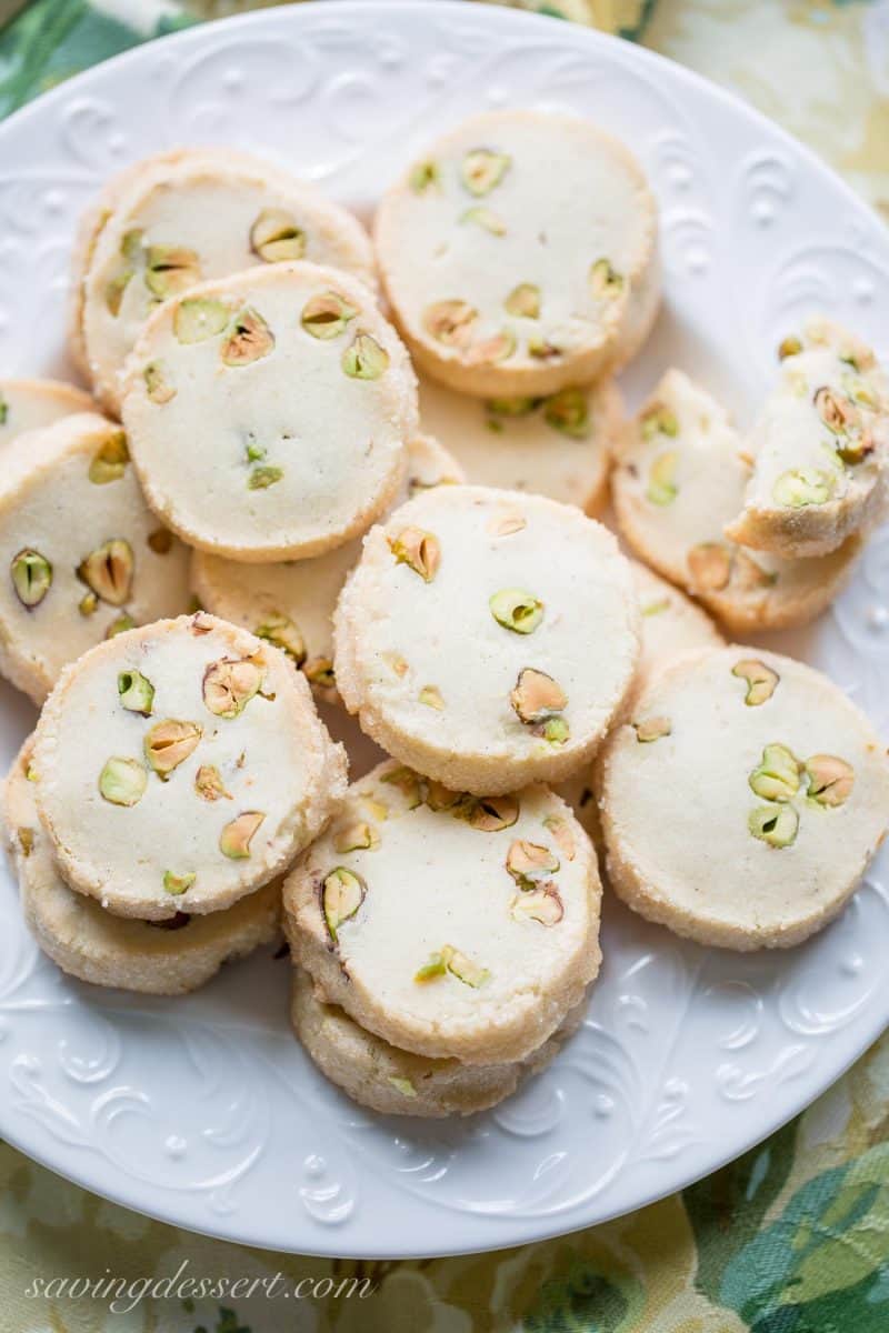 A plate of shortbread cookies filled with pistachios