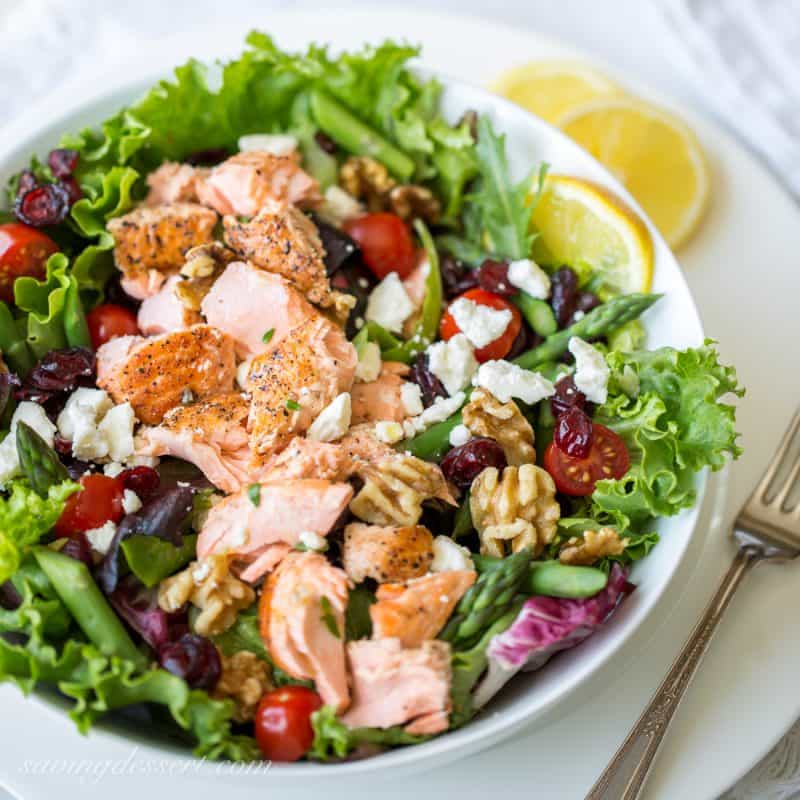 Salmon & Asparagus Salad with Feta cheese, cranberries, and walnuts. A fancy restaurant quality salad at home!