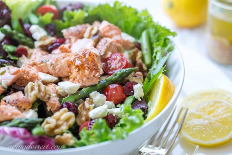 Salmon & Asparagus Salad with Feta cheese, cranberries, and walnuts. A fancy restaurant quality salad at home!