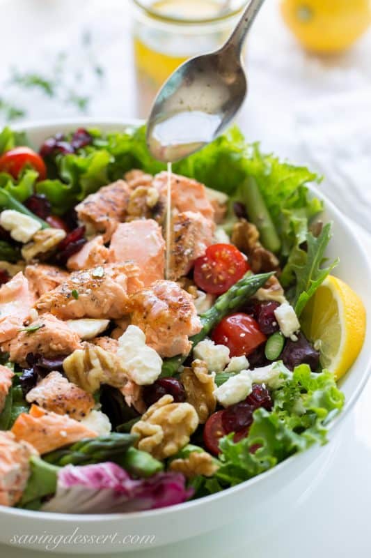 Salmon & Asparagus Salad with Feta cheese, cranberries, and walnuts. A fancy restaurant quality salad at home!