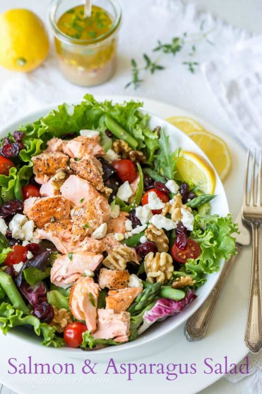 Salmon & Asparagus Salad with Feta cheese, cranberries, and walnuts. A fancy restaurant quality salad at home!