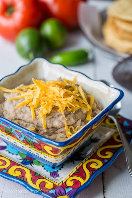 Creamy spicy Homemade Refried Beans. A wonderful side dish or great base for tacos, burritos, quesadillas, nachos or tostadas. www.savingdessert.com