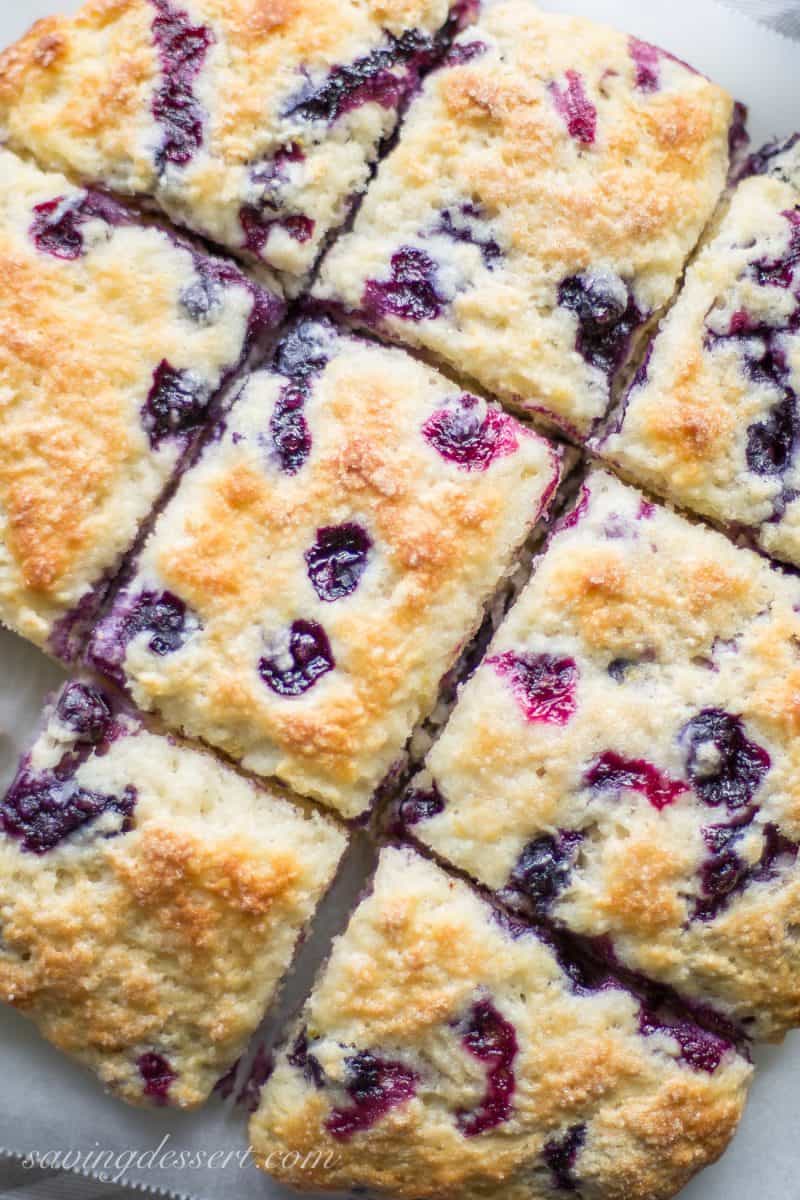 A close up of square sliced blueberry biscuits