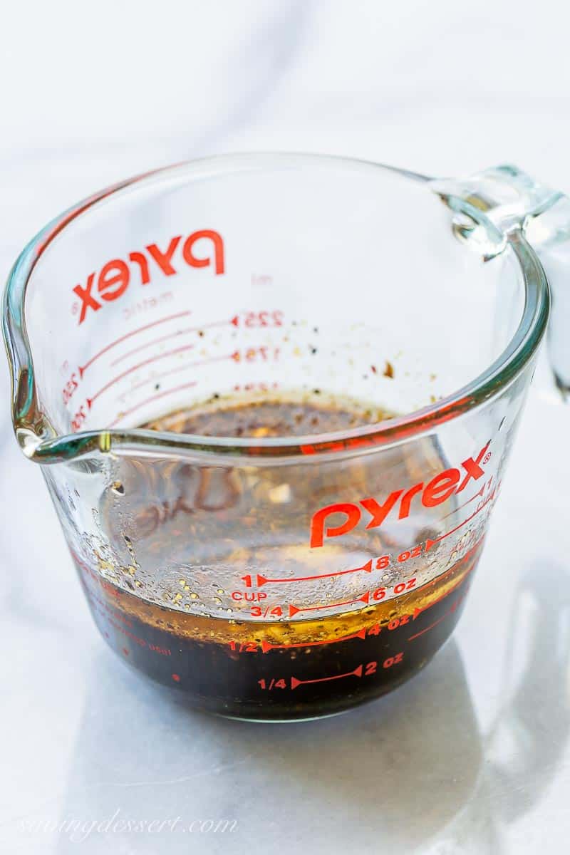 A measuring cup with marinade