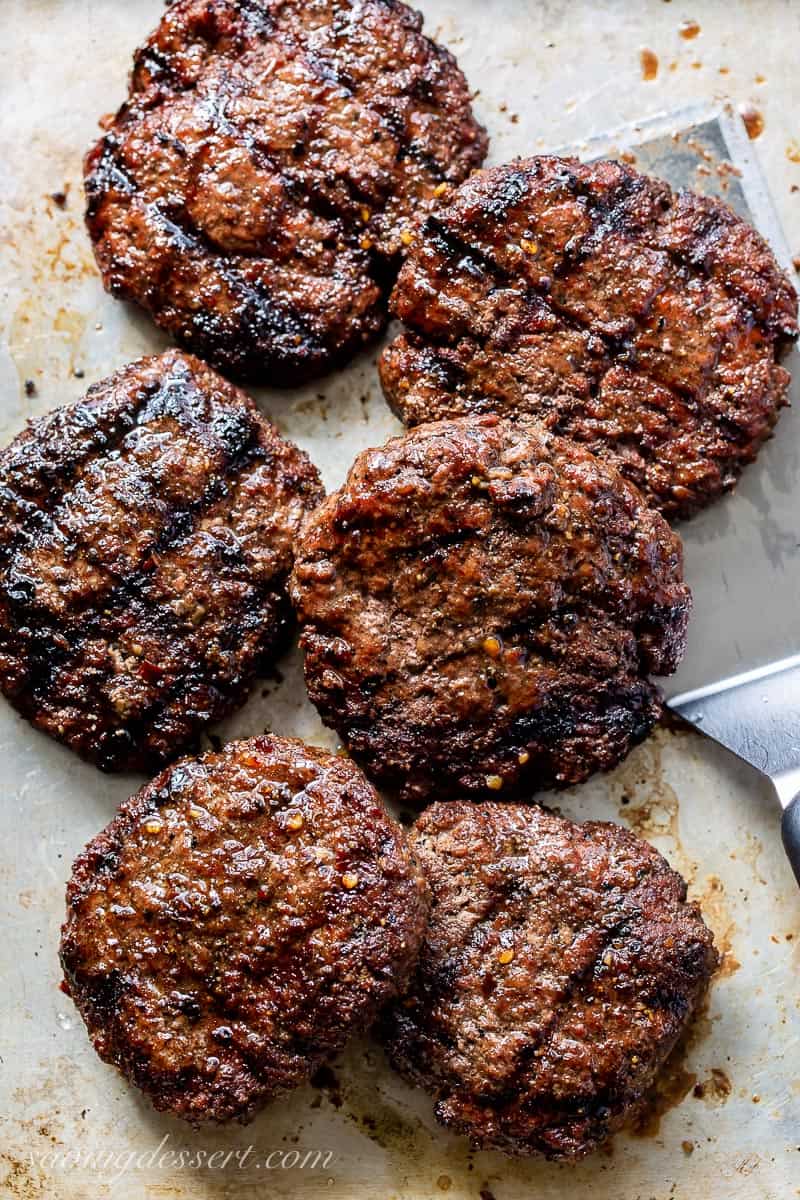 A tray of grilled marinated burgers