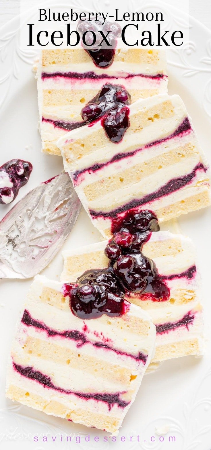 A platter of sliced blueberry and lemon icebox cake drizzled with additional blueberry sauce