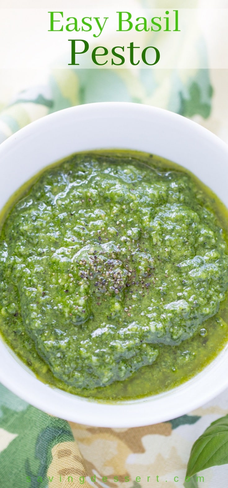 A bowl of homemade basil pesto with black pepper on top