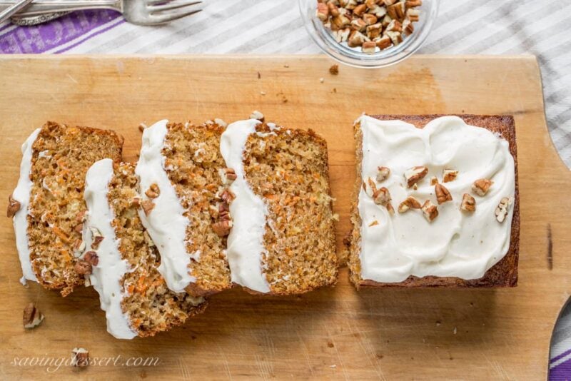 Carrot Loaf Cake - a deliciously moist cake loaded with fresh grated carrots and crushed pineapple, all topped off with a silky smooth cream cheese icing | www.savingdessert.com