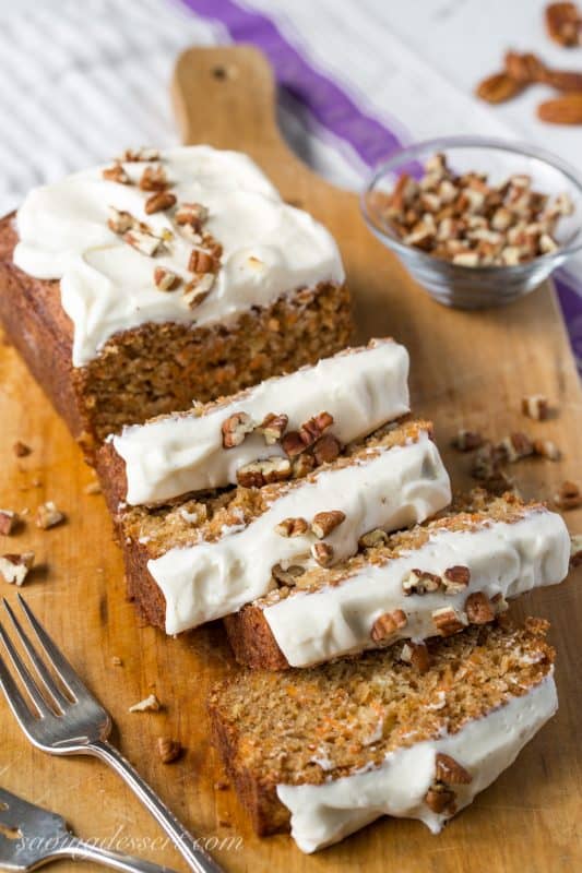 Carrot Loaf Cake - a deliciously moist cake loaded with fresh grated carrots and crushed pineapple, all topped off with a silky smooth cream cheese icing | www.savingdessert.com