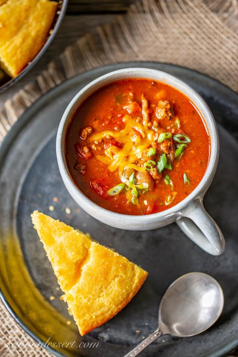 A cup of Chasen's Famous Chili with cornbread