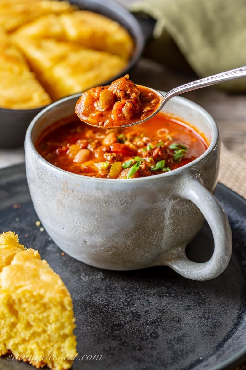 A spoonful of Chasen's Famous Chili with cornbread