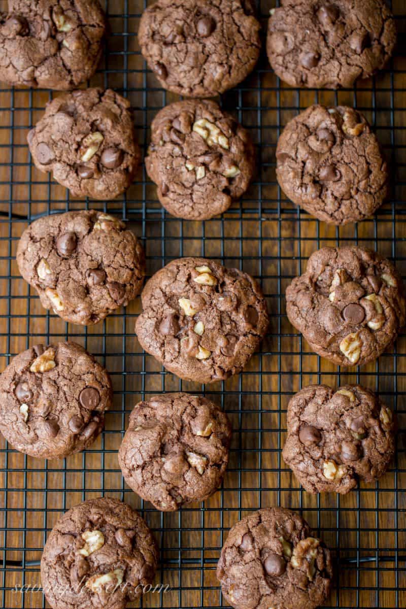 A cooling rack with chocolate chip walnut cookies