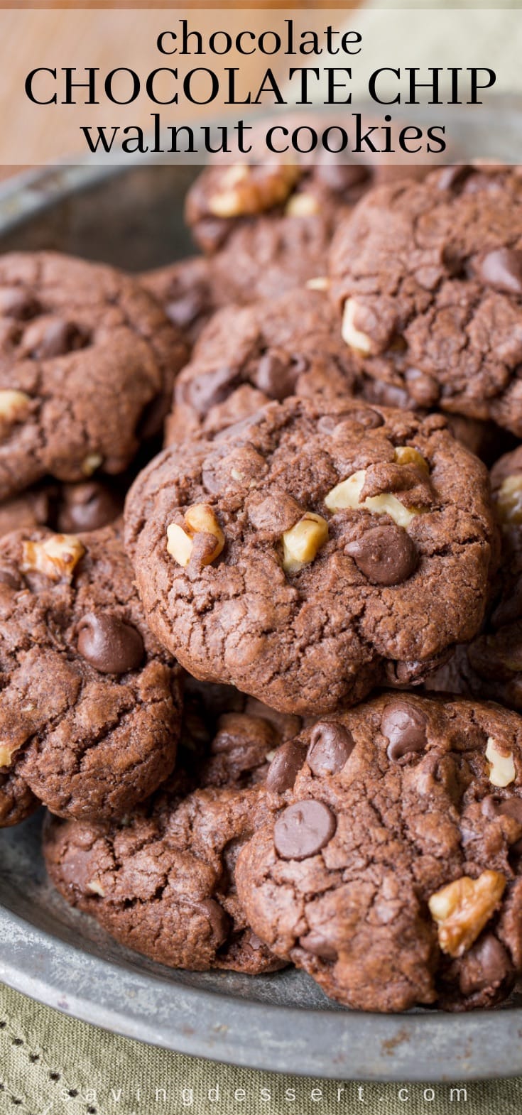 Thick and chewy Chocolate Chocolate-Chip Walnut Cookies have crispy edges, a soft almost brownie-like middle, and are loaded with big chunks of walnuts. #chocolatecookies #walnutcookies #cookies #chocolatechipcookie #chocolatechocolatechipcookie #chocolatewalnutcookie #easycookie