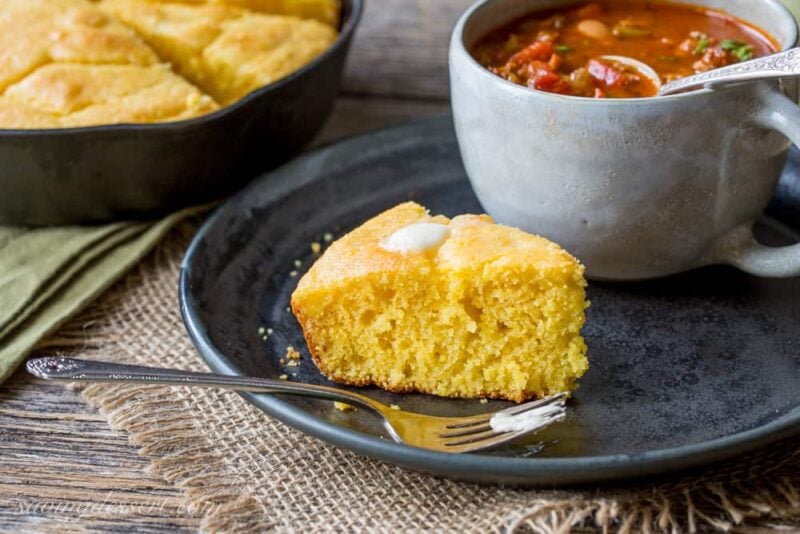 Easy Skillet Buttermilk Cornbread - perfect served with add-ins like cheese and hot peppers, cornbread is an inexpensive side dish great served with a simple bowl of pinto beans, chili, stew or soup. www.savingdessert.com