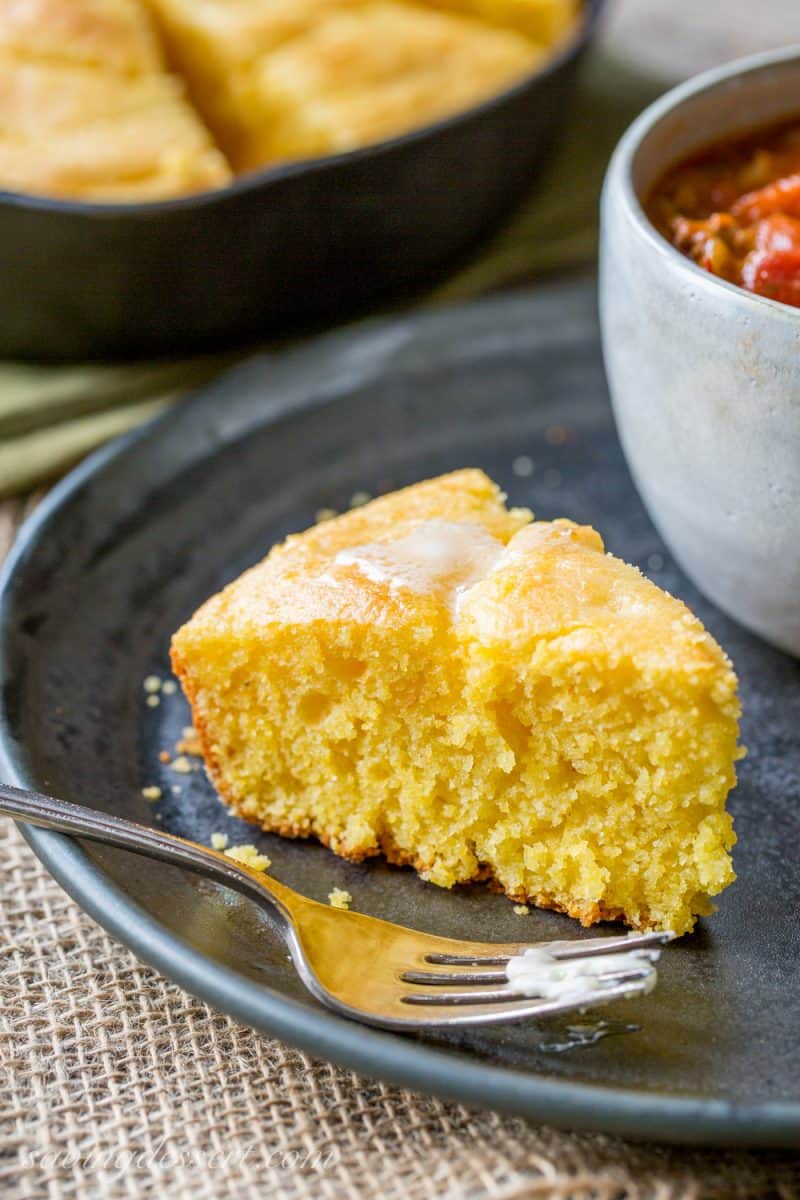 Easy Skillet Buttermilk Cornbread - perfect served with add-ins like cheese and hot peppers, cornbread is an inexpensive side dish great served with a simple bowl of pinto beans, chili, stew or soup. www.savingdessert.com