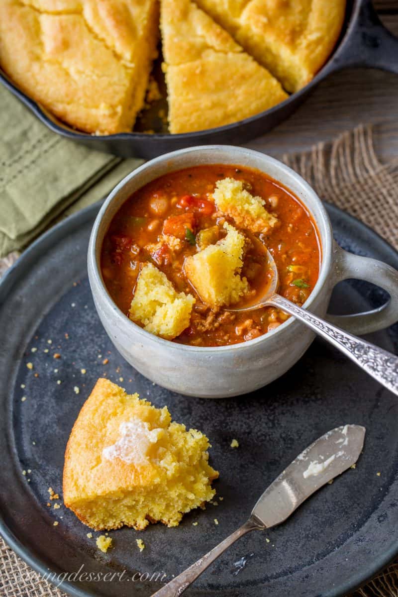 Easy Skillet Buttermilk Cornbread - perfect served with add-ins like cheese and hot peppers, cornbread is an inexpensive side dish great served with a simple bowl of pinto beans, chili, stew or soup. www.savingdessert.com