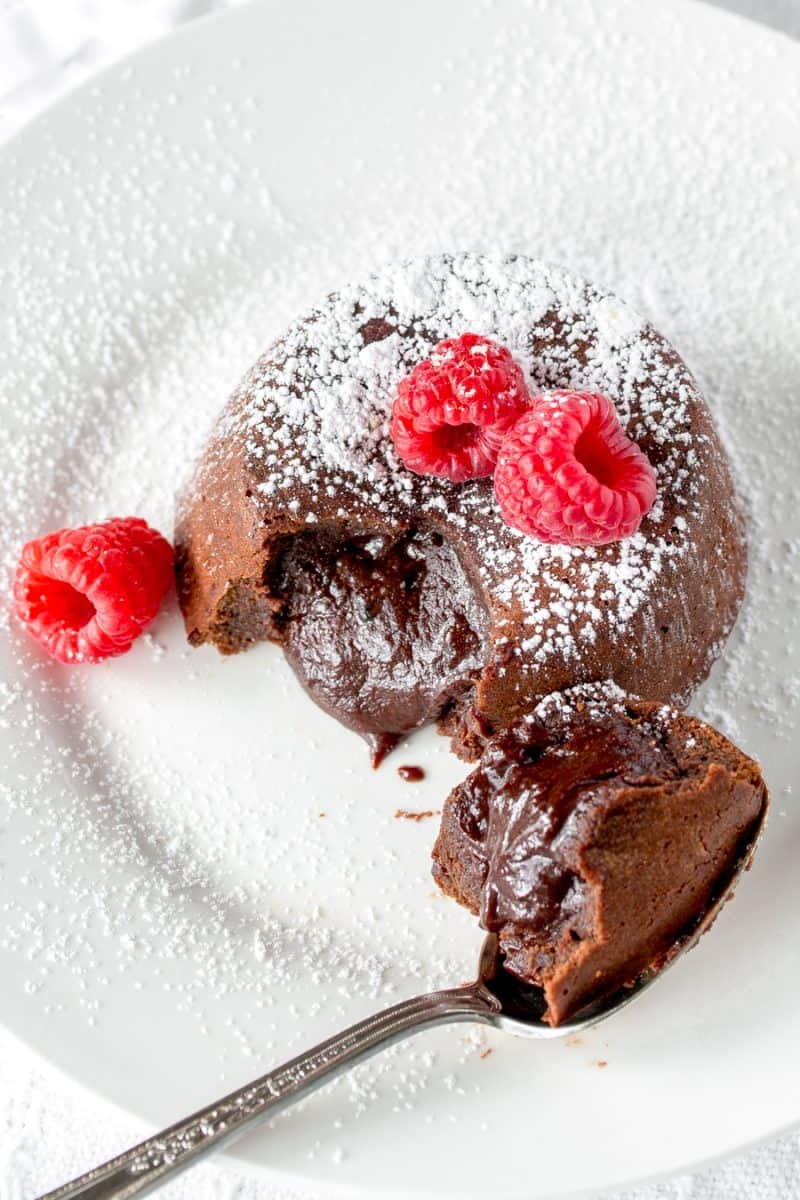 Molten Chocolate Cake -famous for it’s tender, moist cake, a light crispy crust, and gooey rich chocolate middle. www.savingdessert.com