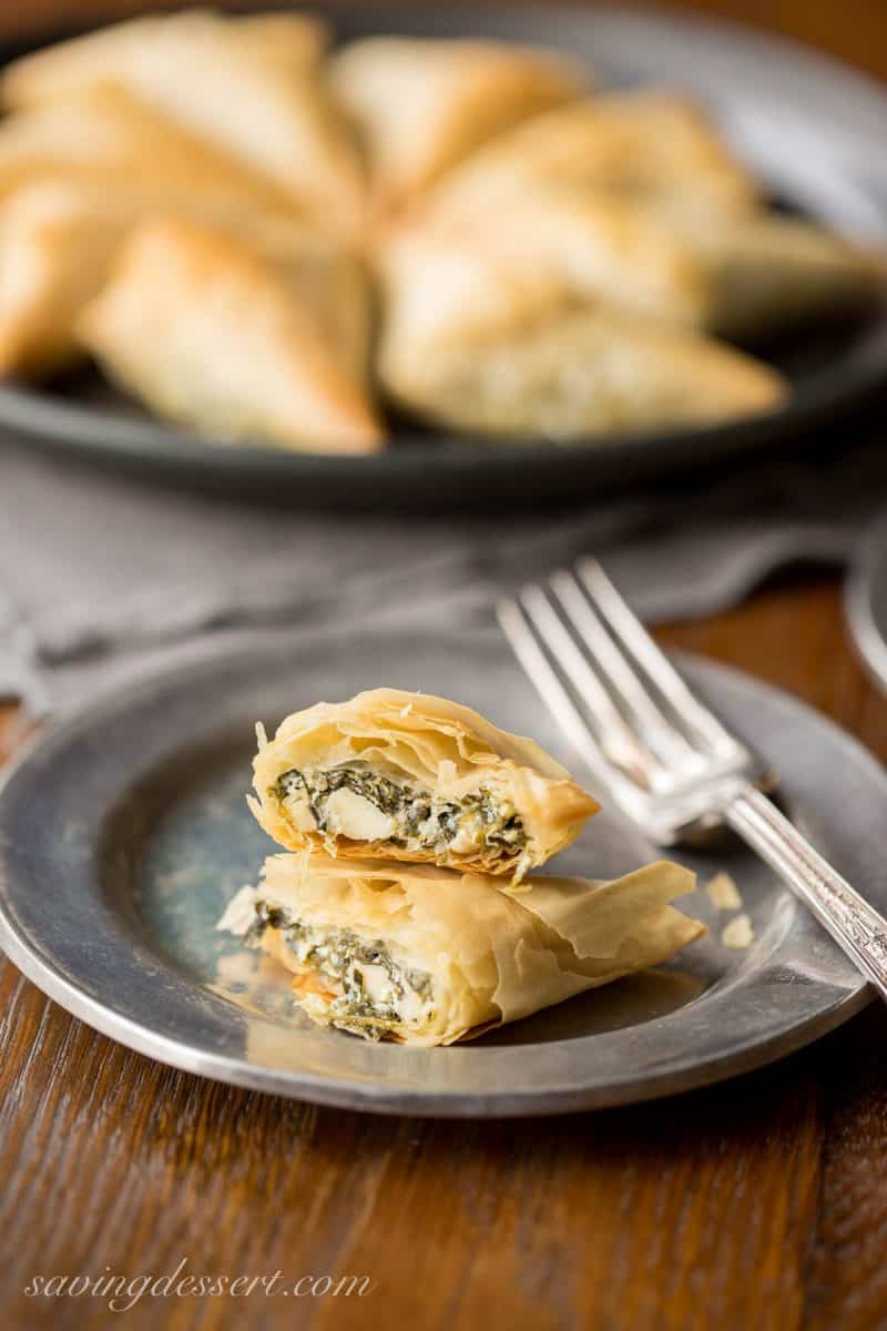 Spanakopita Recipe - the popular and delicious Greek recipe for Spinach and Feta Pie is now a finger-friendly appetizer! www.savingdessert.com