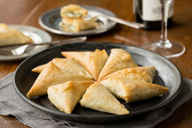 Spanakopita Recipe - the popular and delicious Greek recipe for Spinach and Feta Pie is now a finger-friendly appetizer! www.savingdessert.com